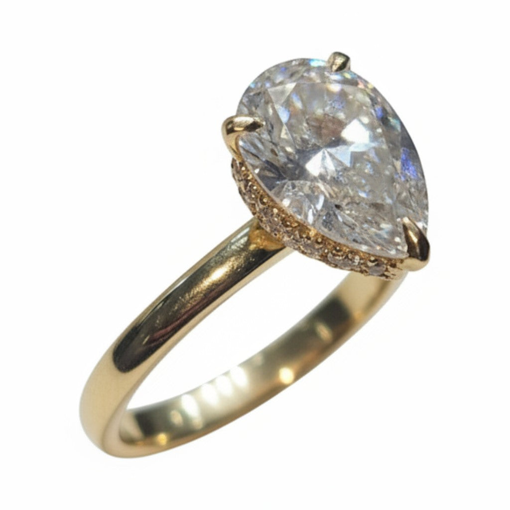 Jade18k 18k yellow gold pear cut moissanite engagement ring with pavé band.