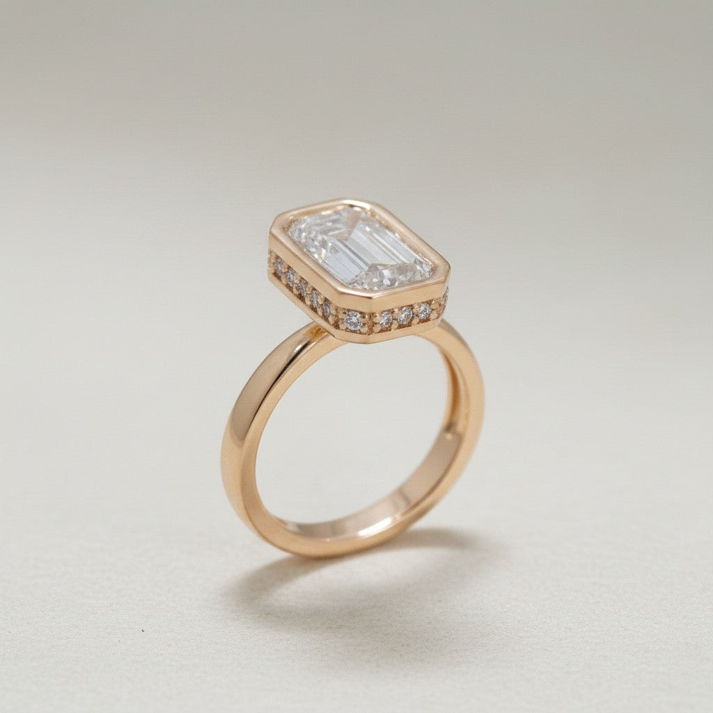 Jade18k Fátima engagement ring in 18k rose gold with a large emerald-cut lab-grown diamond and pavé side stones.
