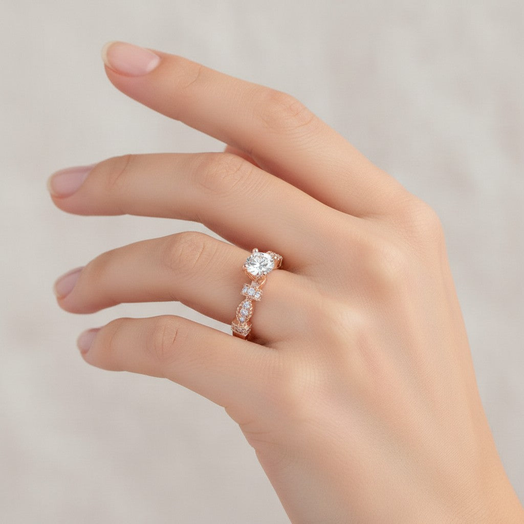 Jade18k Queen engagement ring with moissanite center stone and rose gold band with diamond accents.