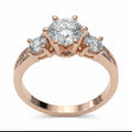 Jade18k 18k rose gold ring with a large central moissanite and two smaller moissanites on the sides, brilliant cut.