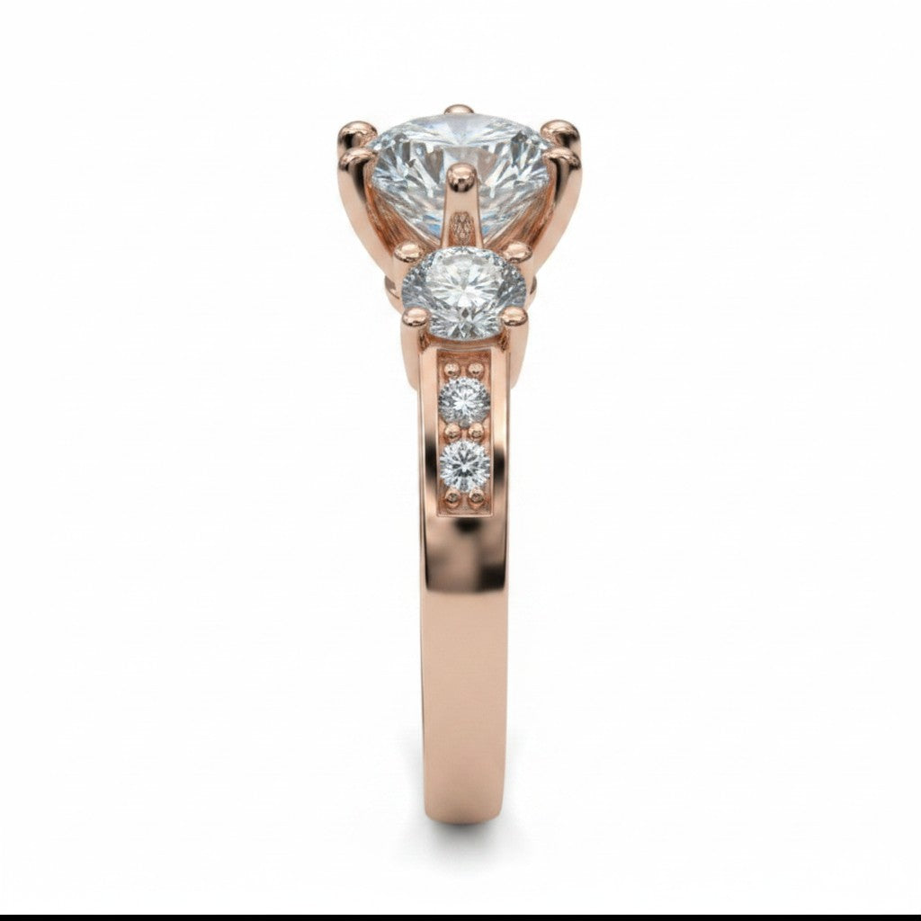 Jade18k rose gold 18k ring with a large central moissanite and two smaller side moissanites. The band features channel-set stones.