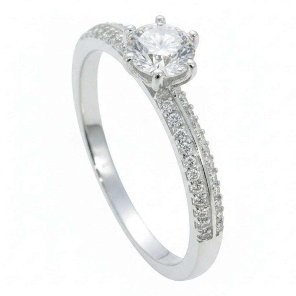 Jade18k engagement ring in silver with a round-cut center stone and pavé-set accent stones on the band.