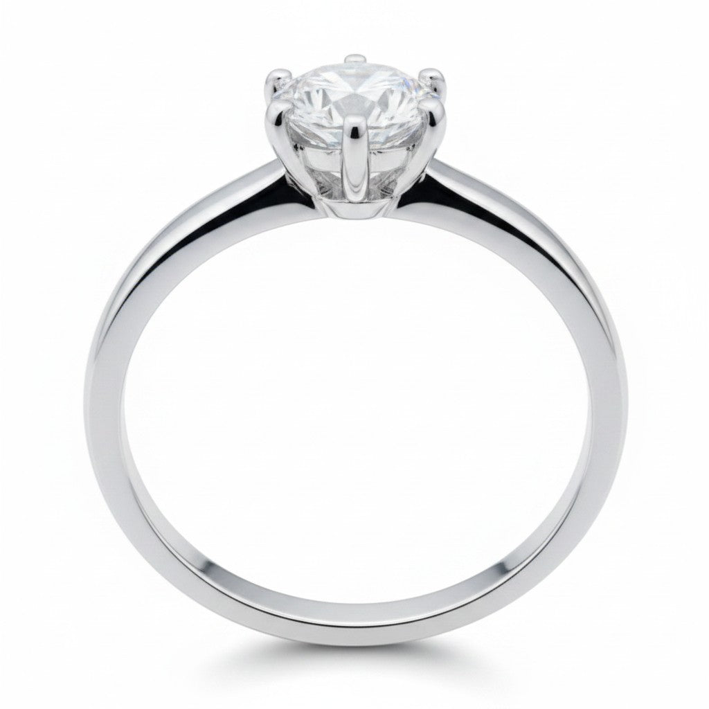 Jade18k Anillo Sueño de Amor in fine silver with a round-cut cubic zirconia solitaire.