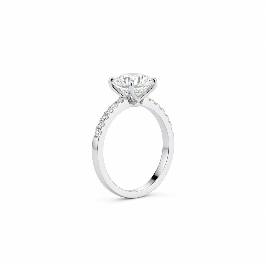 Jade18k Rafaella sterling silver engagement ring with a central round-cut diamond and pavé band.