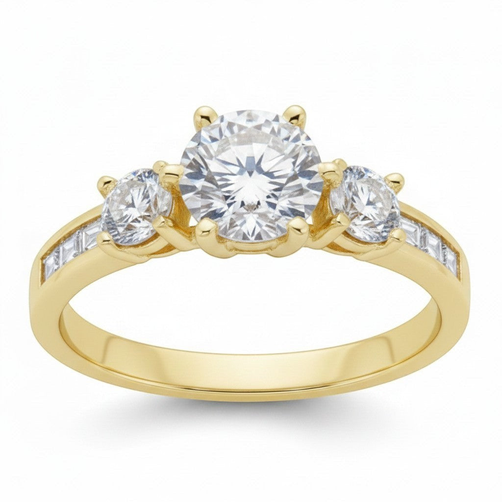 Jade18k three-stone engagement ring in yellow gold with round-cut center stone and channel-set baguette and round stones.