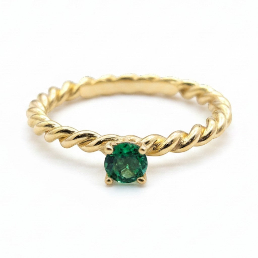Jade18k 14k yellow gold ring with a twisted band and a round green emerald solitaire.