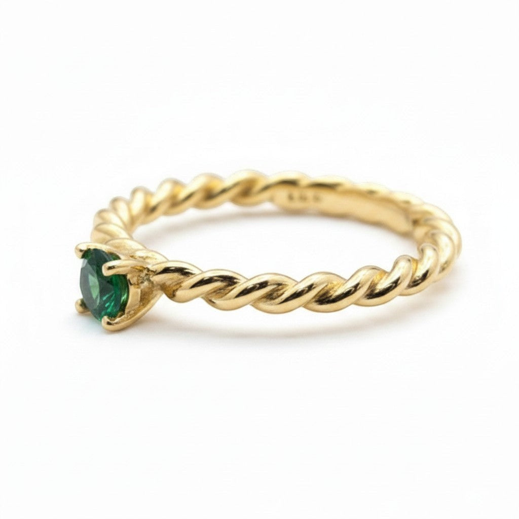Jade18k 14k yellow gold twisted band solitaire ring with a green emerald centerpiece.