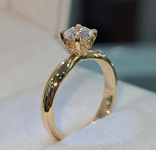 Jade18k Aurora engagement ring in 18k yellow gold with a lab-grown diamond and moissanite side stones.