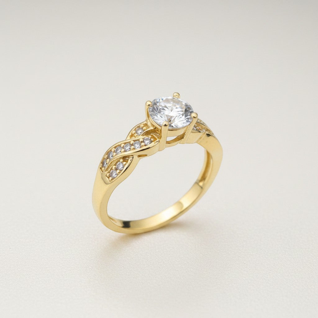 Jade18k 18k yellow gold engagement ring with a single central diamond and pave diamond band.