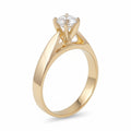 Jade18k Aitana engagement ring in 18k yellow gold with a round-cut cubic zirconia stone.