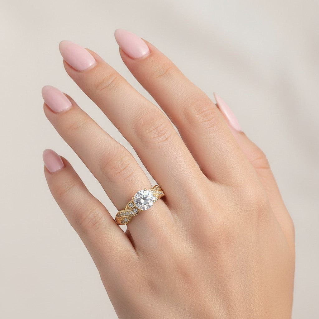 Jade18k 18k yellow gold engagement ring with a single central diamond and a twisted band adorned with small diamonds.