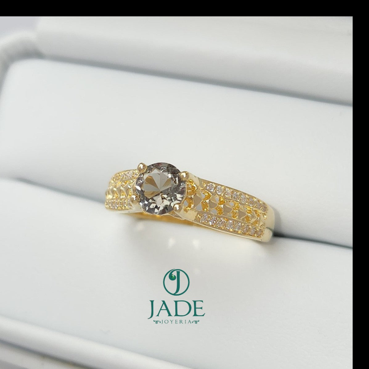 Jade18k Mariel engagement ring in 18k yellow gold with a grey zircon stone and diamond accents.