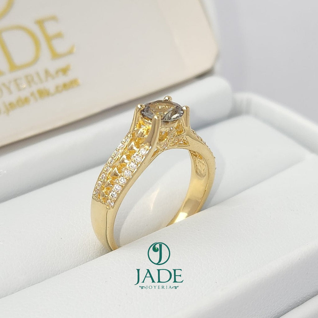 Jade18k Mariel engagement ring in 18k yellow gold with a zircon stone and pave diamond band.