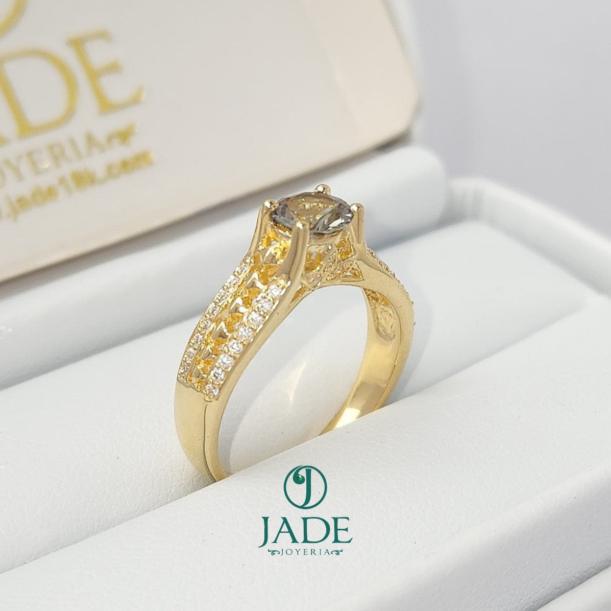 Jade18k Mariel engagement ring in 18k yellow gold with a zircon stone and pave diamond band.