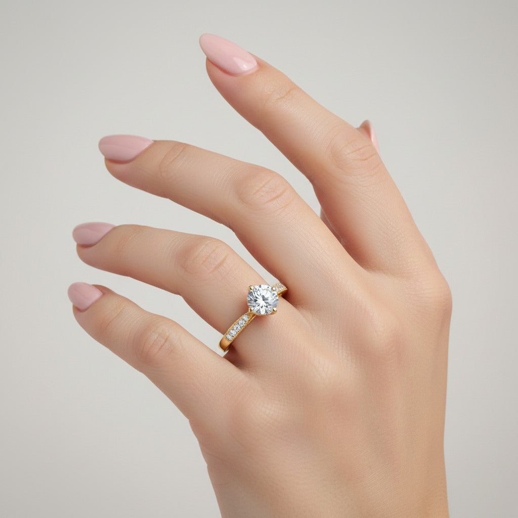 Jade18k 18k yellow gold engagement ring with a central moissanite and pavé-set stones on the band.