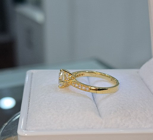 Jade18k 18k yellow gold engagement ring with moissanite stones and a princess cut center stone.
