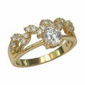 Jade18k 18k yellow gold engagement ring with a central moissanite and smaller stones along the band.