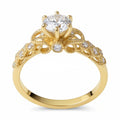 Jade18k yellow gold 18k engagement ring with a central moissanite stone and intricate detailing on the band.