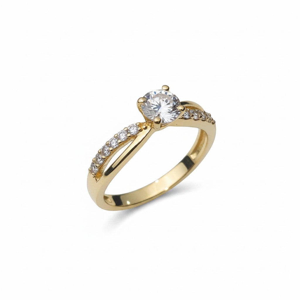 Jade18k 18k yellow gold engagement ring with a central moissanite stone and a band adorned with small diamonds.