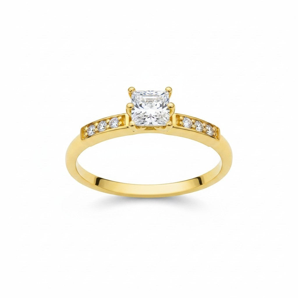 Jade18k 18k yellow gold engagement ring with a princess-cut moissanite center stone and channel-set accent stones.