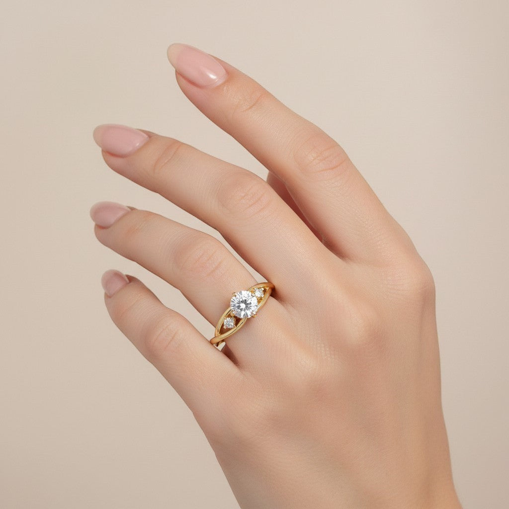 Jade18k yellow gold engagement ring with a central moissanite stone and smaller accent stones on a braided band.