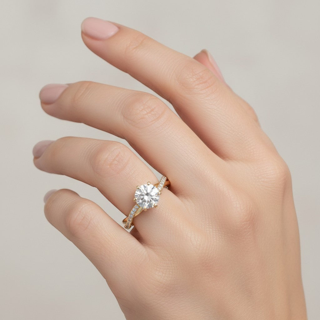 Jade18k 18k yellow gold engagement ring with a round moissanite center stone and diamond-accented band.