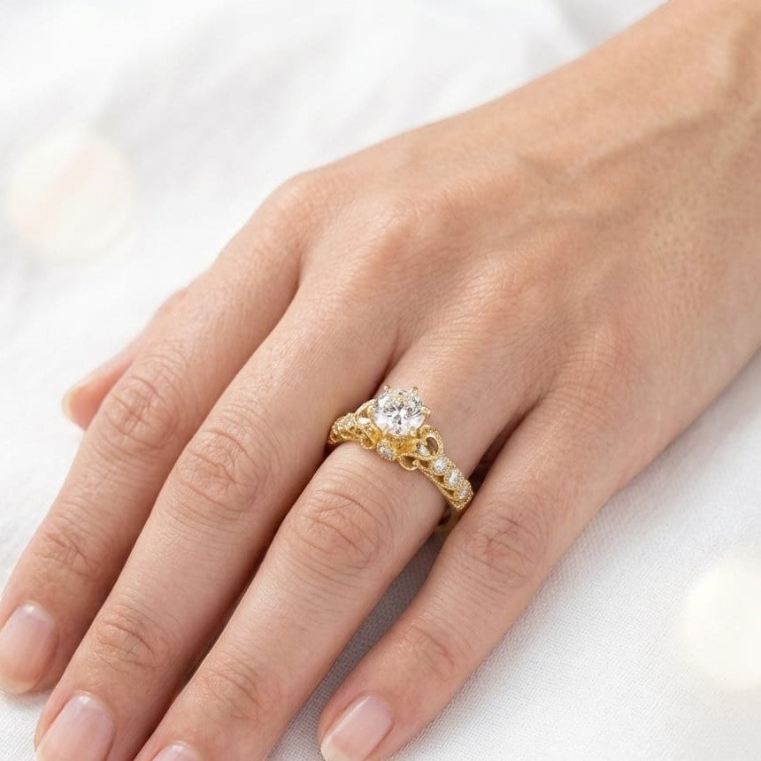 Jade18k 18k yellow gold ring with a central moissanite stone and intricate detailing along the band.