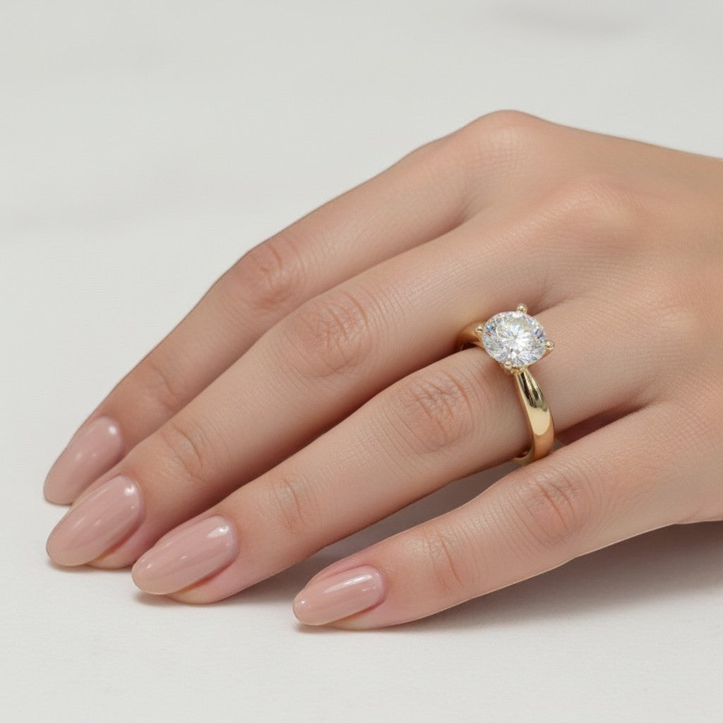Jade18k 18k yellow gold ring with a large, brilliant moissanite center stone. Classic solitaire setting.