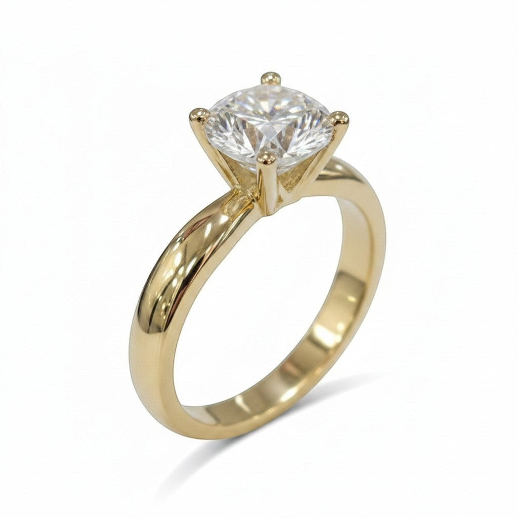 Jade18k 18k yellow gold ring with a brilliant cut moissanite solitaire.