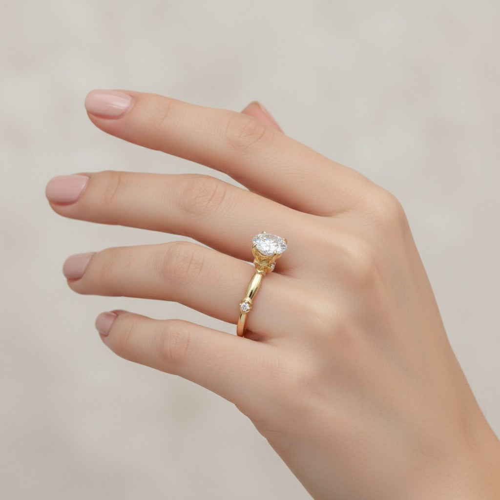 Jade18k 18k yellow gold engagement ring with a large oval moissanite center stone and small accent diamonds on the band.
