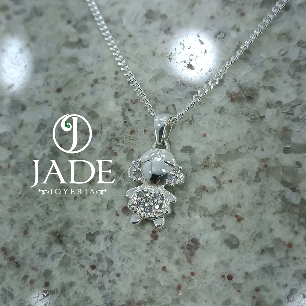 Dije de niña pequeña con moñitos en plata ley