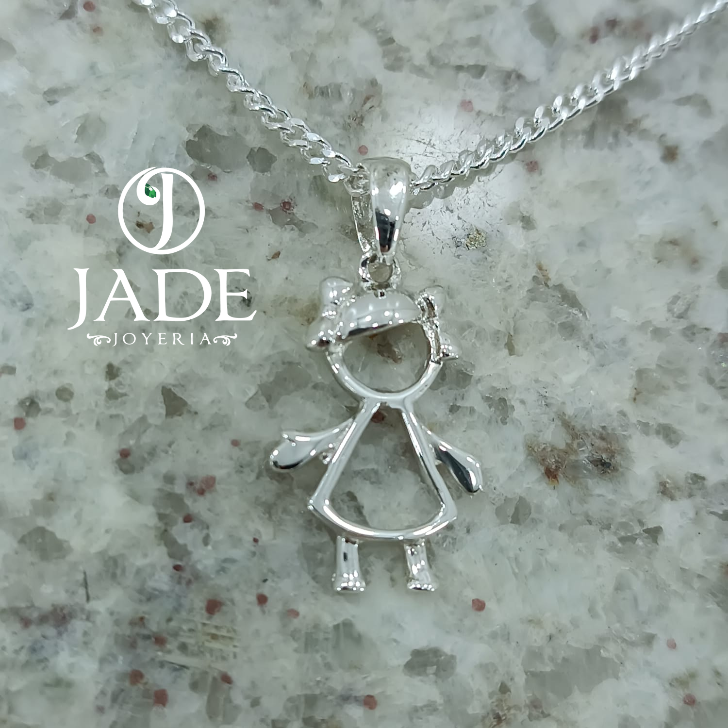 Dije silueta de niña en plata ley