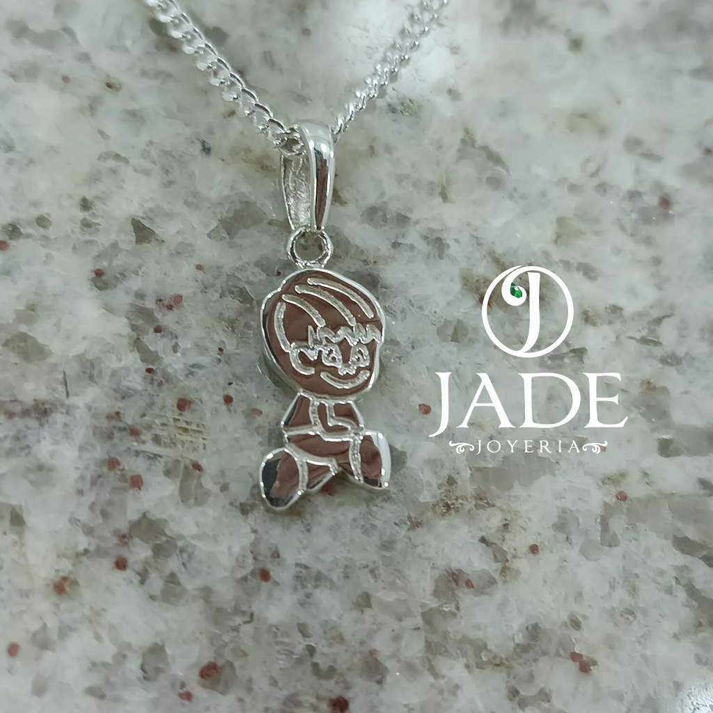 Dije de niño en relieve  plata ley