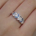 Anillo de hojas con piedras azul en plata fina