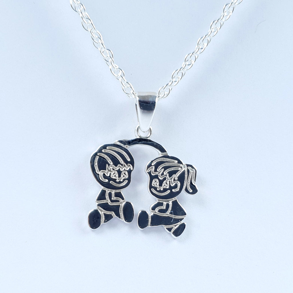 Dije Niño y Niña Plata Ley