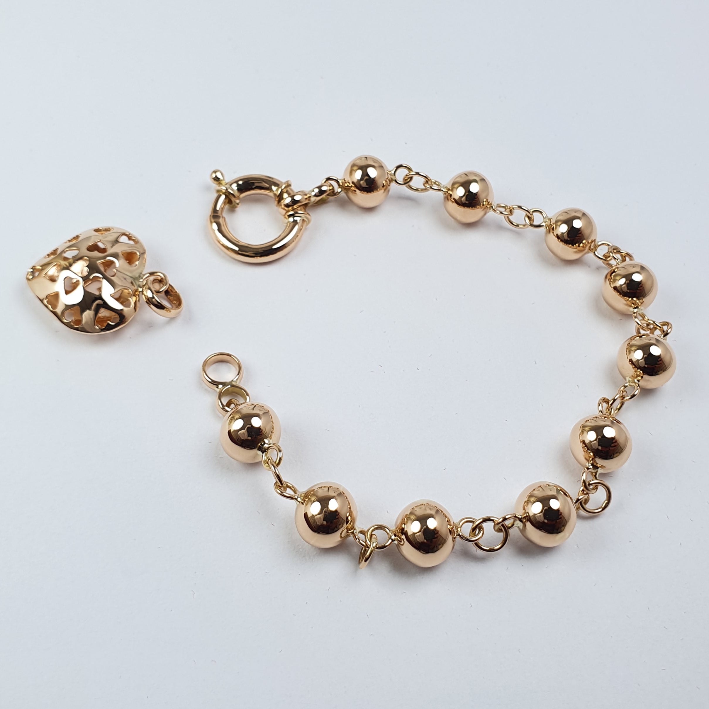 Pulsera de Bolitas con Dije de Corazón