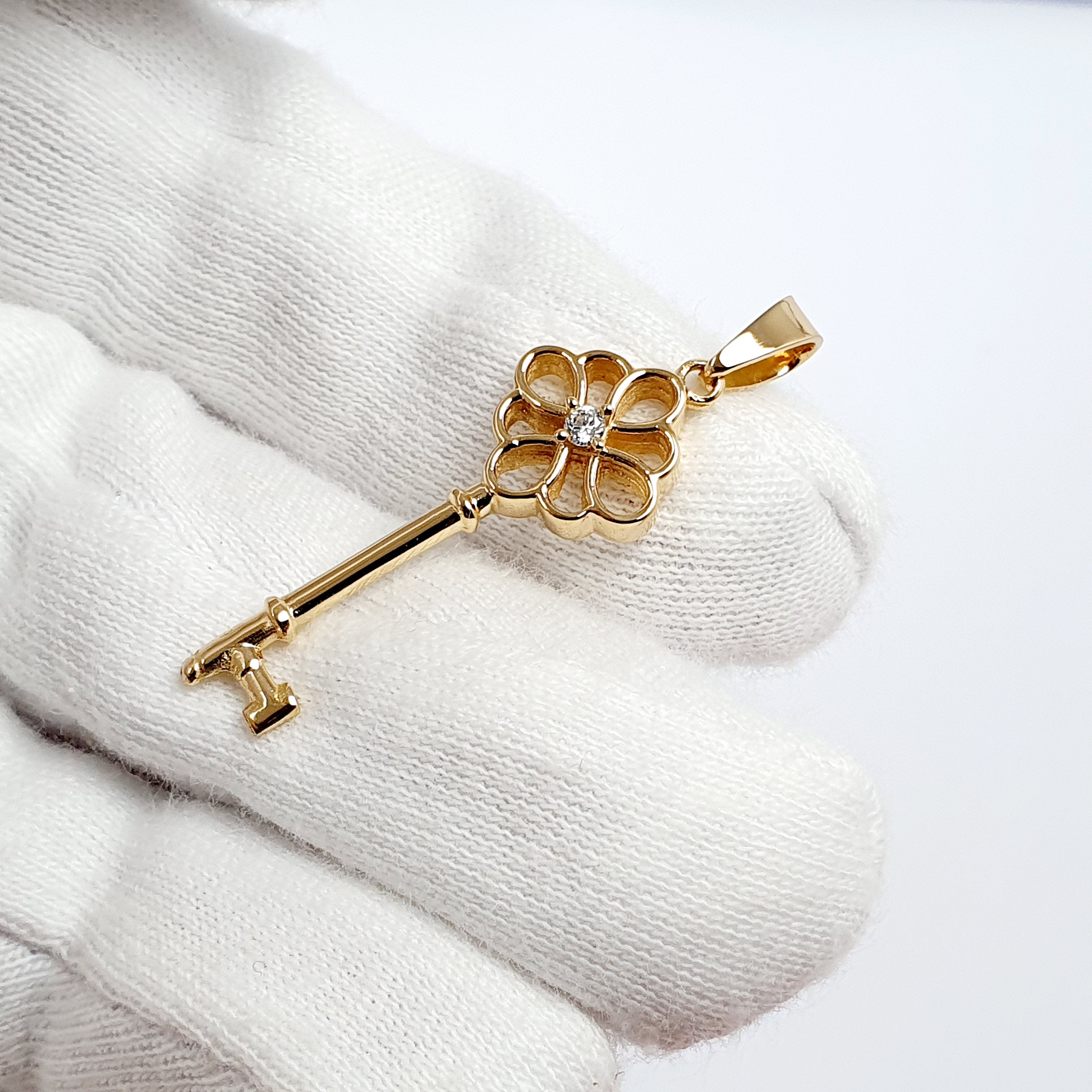Dije de llave en oro 18k