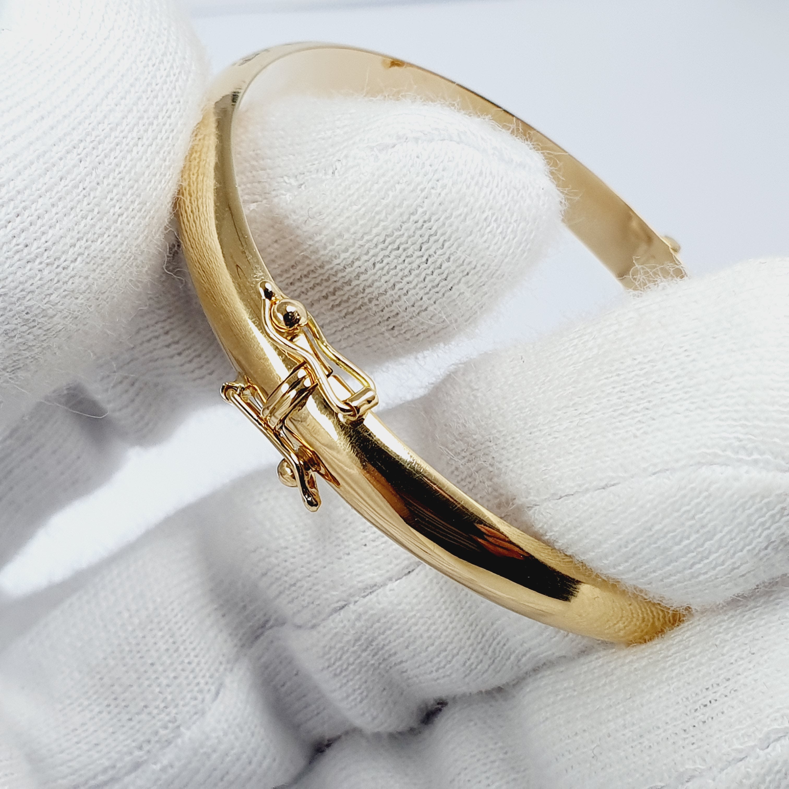 Puñera con dije de llave y candado oro 18k