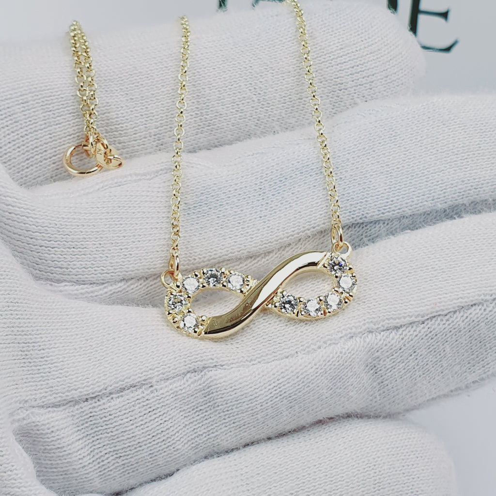 Collar infinito con piedras oro 18k
