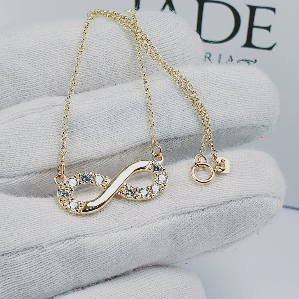 Collar infinito con piedras oro 18k