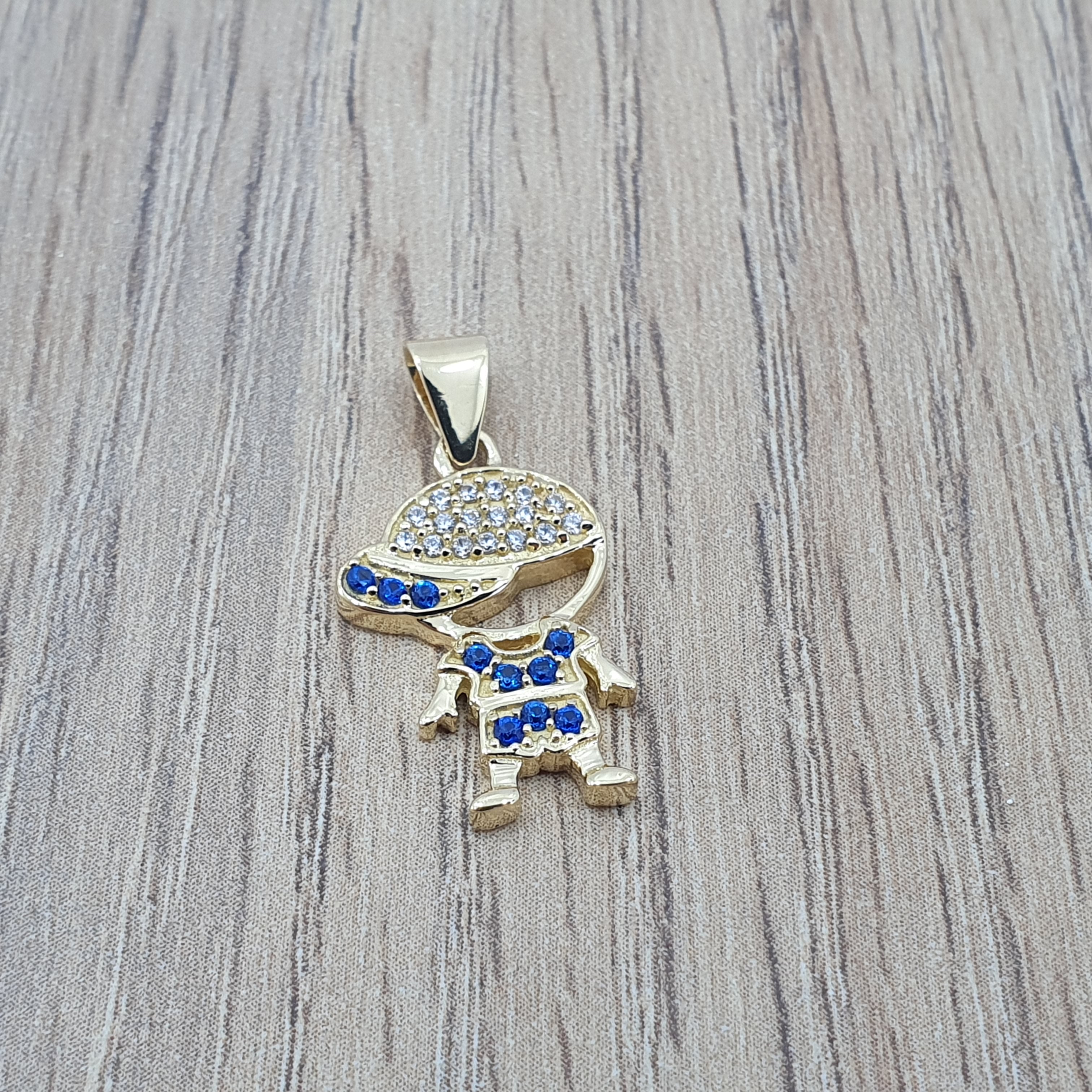 Dije de niño oro 18k con circones