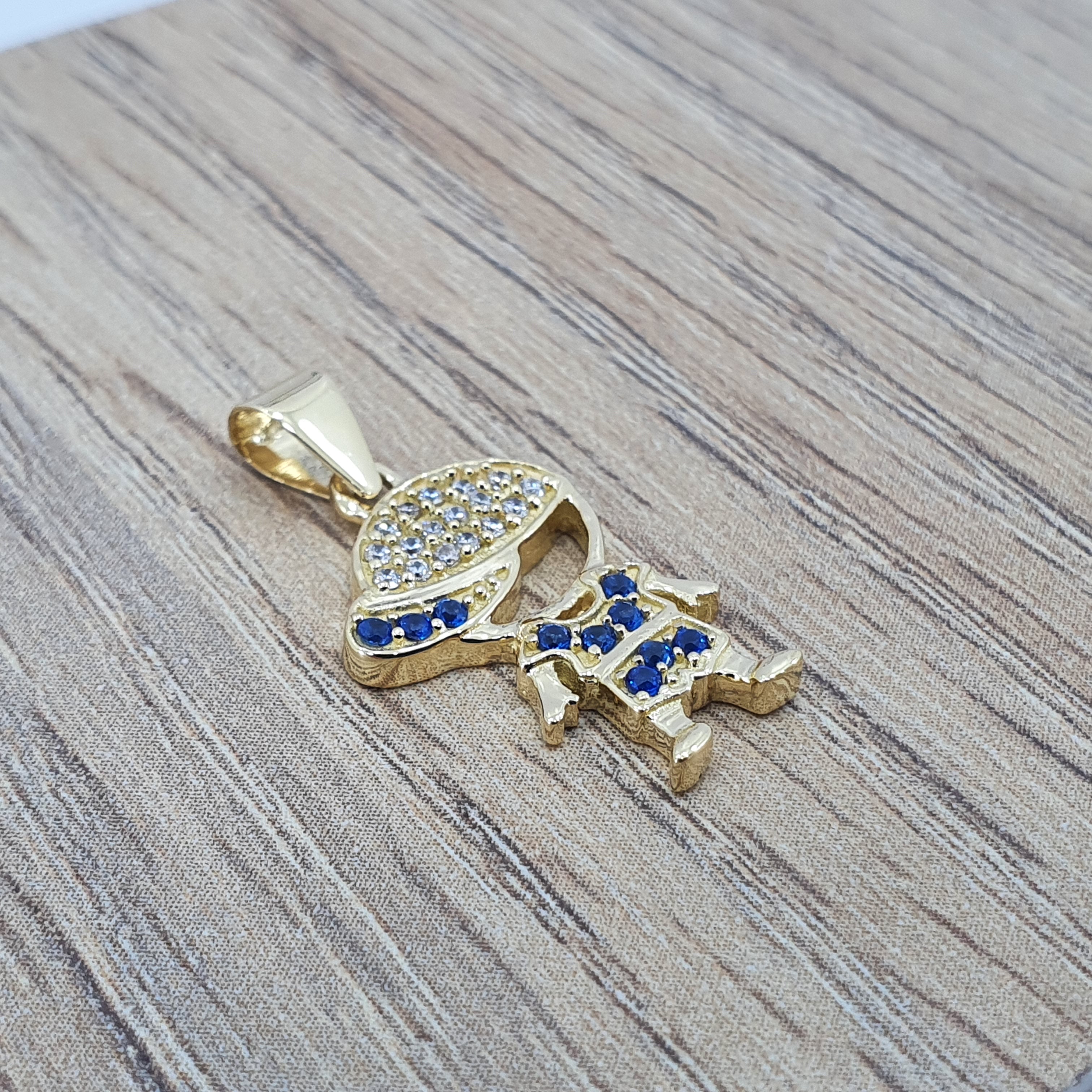 Dije de niño oro 18k con circones