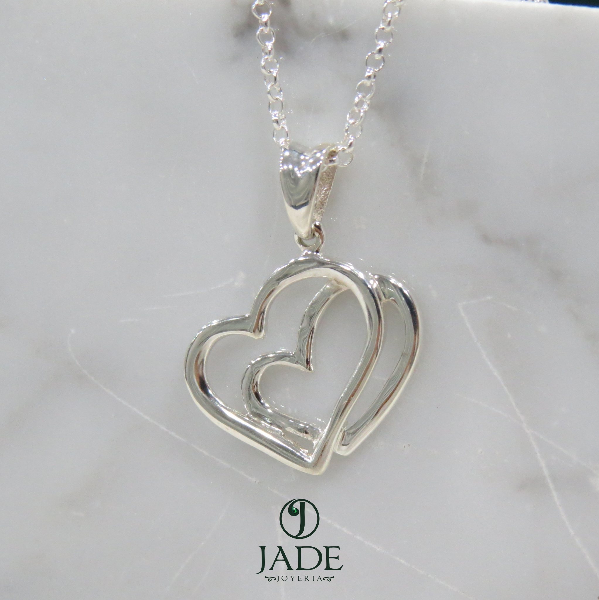Dije de doble corazón