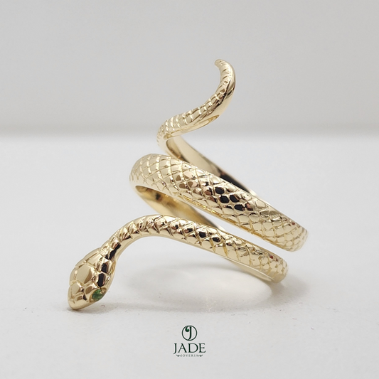 Anillo de serpiente con piedras en los ojos en oro de 18k
