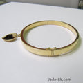 Puñera con dije corazón en oro 18k
