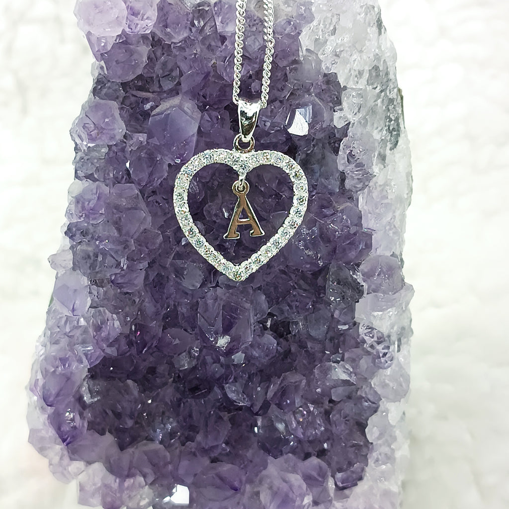 Dije con dije de corazon personalizados en plata fina.