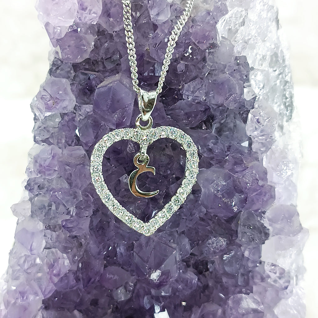 Dije con dije de corazon personalizados en plata fina.